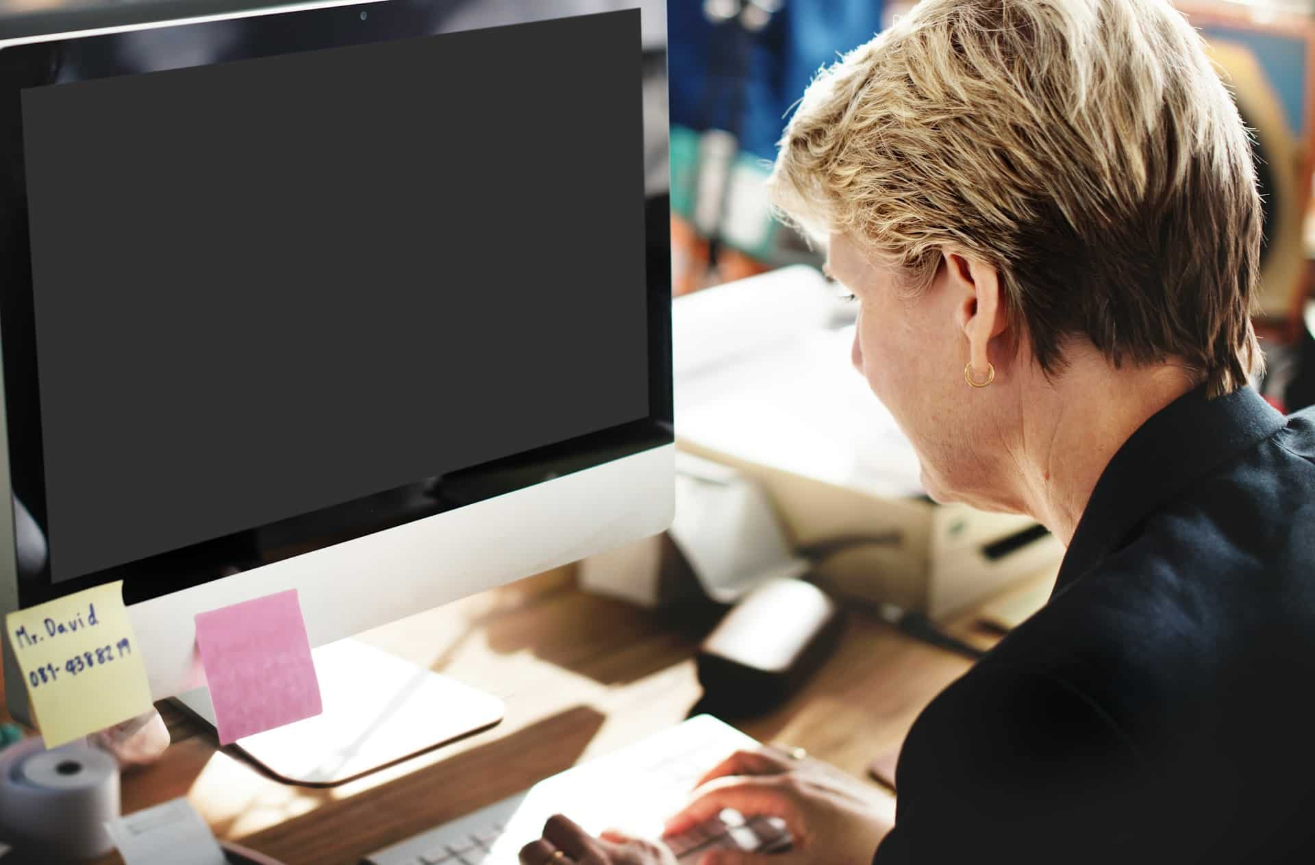 a person sitting at a computer